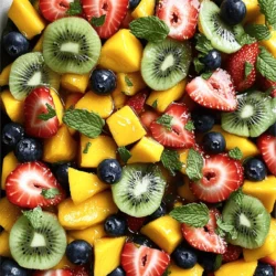 To make this salad pop, you need fresh fruits. Here is the list I love: - 1 cup strawberries, hulled and halved - 1 cup mango, diced - 1 cup kiwi, peeled and sliced - 1 cup blueberries - 1 orange, segmented These fruits blend well together. They offer sweet, tangy, and juicy flavors. You can also mix in other fruits if you like. Try adding bananas, peaches, or grapes for variety. The secret dressing makes this salad shine. Here are the special ingredients: - 1 tablespoon honey - 1 teaspoon fresh mint, chopped (plus extra for garnish) - ½ teaspoon lime zest - 1 tablespoon lemon juice - Pinch of sea salt This dressing balances the fruit with sweetness and a hint of mint. The lime zest adds a nice zing. Mixing these ingredients creates a refreshing taste that makes your fruit salad unique. To finish your salad, you can add some garnishes: - Extra mint leaves - A sprinkle of lime zest - A drizzle of honey These garnishes make the salad look pretty and enhance its flavor. You can have fun with these options. Choose what sounds best to you! For the full recipe, refer to the section above. Start by washing all your fruits. For strawberries, hull and halve them. Dice the mango into small cubes. Peel and slice the kiwi. Make sure to rinse the blueberries. Lastly, segment the orange into bite-sized pieces. Place all the prepared fruits in a large mixing bowl. This mix gives your salad great color and taste. In a small bowl, mix the honey with chopped mint. Add the lime zest and lemon juice. Sprinkle in a pinch of sea salt. This dressing makes the fruits pop with flavor. It’s easy and quick to make. The mint adds a fresh taste, while the honey brings sweetness. Pour the secret dressing over the mixed fruits. Use a large spoon to gently toss everything together. Be careful not to mash the fruits! Let the salad sit for about 10 minutes. This step helps the flavors blend well. When ready, serve in bowls and add extra mint for a nice touch. For the full recipe, click here. When I pick fruits, I always look for fresh and ripe options. For strawberries, choose bright red ones with no white spots. Mangoes should feel slightly soft when you press them. Kiwi should be firm but not too hard. Blueberries must be plump and shiny. For oranges, select ones that feel heavy for their size. This means they are juicy! Always smell the fruit. It should have a sweet scent. To bring out the best in your fruit salad, I love using a secret dressing. It adds depth and brightness. I mix honey, mint, lime zest, lemon juice, and a pinch of sea salt. The honey adds sweetness, while lime and lemon give a nice zing. Fresh mint adds a cool touch. Together, these flavors make the fruit pop! Letting the salad sit for a bit helps the flavors blend well. A beautiful fruit salad makes it even more enjoyable. I usually serve it in clear bowls. This way, the colors shine through. You can layer the fruits for a colorful look. Garnish the salad with extra mint leaves for a fresh touch. A sprinkle of lime zest on top adds a nice visual pop too. Don't forget to serve it right after mixing to keep it vibrant and fresh! For the full recipe, check out the details above. {{image_2}} You can change this salad to fit your taste. Try adding tropical fruits. Pineapple, papaya, and banana work great. They add sweet and tangy flavors. Mix in some coconut for a fun twist. You can use fresh or dried coconut. This adds a chewy texture that is lovely. Nuts or seeds can give a nice crunch. I like chopped almonds or walnuts. They add protein and healthy fats. Sunflower seeds or pumpkin seeds are also great. They bring a nutty taste without being too heavy. Just sprinkle them on top before serving for a fresh look. For those who enjoy dairy, add some yogurt. Greek yogurt gives creaminess and protein. You can mix it in or serve on the side. A dollop of whipped cream can also be a treat. It makes the salad feel fancy and rich. Just remember, balance is key. You want to keep the fruit flavors shining through. For the full recipe, check out the Secret Ingredient Fruit Salad. To keep your fruit fresh, store it in the fridge. Use a sealed container to prevent air exposure. Avoid washing fruits until you are ready to eat them. Washing can add moisture and cause spoilage. Keep fruits separate to prevent bruising. For example, store berries in a single layer. This helps them stay firm and fresh longer. The Secret Ingredient Fruit Salad stays fresh for about three days. After that, the fruits start to lose their taste and texture. If you notice any browning or mushiness, it’s best to toss it out. Always check for signs of spoilage, like a sour smell or slimy texture. You can make this salad a few hours before serving. Just keep the fruit and dressing separate. This way, the fruits stay crisp and fresh. Mix them together just before serving. If you want to prepare it a day ahead, cut fruits like apples and bananas last. They brown quickly, so use lemon juice to help keep them bright. You can find the Full Recipe for more detailed steps. The secret ingredient in this fruit salad is the dressing. It combines honey, fresh mint, lime zest, lemon juice, and a pinch of sea salt. This mix enhances the fruit's taste. The honey adds sweetness, while mint offers a refreshing kick. Lime zest and lemon juice bring a bright tartness. The sea salt balances the flavors perfectly. Together, these ingredients create a simple yet vibrant dressing. You’ll find it makes the fruit shine and taste even better. Yes, you can use frozen fruit in this salad. Just remember to thaw it first. Frozen fruit can be softer than fresh fruit. This can change the texture of your salad. For best results, use frozen fruit that has no added sugar. If you use frozen fruit, the salad may need less time to sit. However, fresh fruit always offers the best texture and taste. Making this salad vegan-friendly is easy! Simply replace honey with agave syrup or maple syrup. Both options provide sweetness without honey. The rest of the recipe remains the same. This way, you can still enjoy the bright flavors of the fruit. You won’t miss out on the deliciousness of the salad. This simple swap keeps the dish plant-based while staying tasty. This blog post guides you on making a tasty fruit salad from scratch. We covered fresh fruits, secret dressing, and optional garnishes to boost flavor. The step-by-step instructions show how to prepare the fruits, mix the dressing, and combine everything perfectly. I shared tips on selecting fruits and presenting your dish well. In the end, remember that fruit salad can have many fun twists and storage tips help keep it fresh. Enjoy creating your colorful and tasty masterpiece!