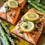 For this dish, I use four salmon fillets. Each fillet weighs about six ounces. Fresh salmon makes the meal rich and tasty. Look for fillets with bright color and no fishy smell. This ensures quality and freshness in your dish. You will need one bunch of asparagus, trimmed to remove the tough ends. Asparagus adds a nice crunch and color. Choose firm, bright green stalks for the best results. They should snap when bent, showing they are fresh and ready to cook. The marinade is key to flavor. You will need three tablespoons of olive oil. This helps the marinade stick and adds richness. You also need the juice of one lemon for zesty brightness. I like to slice a second lemon for garnish. You will need four minced garlic cloves. Garlic gives the dish a nice depth of flavor. Fresh thyme leaves and chopped rosemary add herbal notes. Use two teaspoons of each for the best taste. Finally, add salt and pepper to taste, and red pepper flakes if you want some heat. This mix creates a savory, tangy coating that enhances the salmon and asparagus. Start by preheating your oven to 400°F (200°C). This heat is perfect for cooking salmon and asparagus. While your oven warms up, grab a large sheet pan. Line it with parchment paper. This makes cleaning easy and helps your food cook evenly. Now, let’s make the marinade. In a small bowl, combine 3 tablespoons of olive oil, 4 minced garlic cloves, 2 teaspoons of fresh thyme leaves, and 2 teaspoons of chopped rosemary. Squeeze the juice of 1 lemon into the bowl. Add salt and pepper to taste. If you want a bit of heat, toss in 1 teaspoon of red pepper flakes. Mix everything well. This mix adds great flavor to the salmon and asparagus. Next, place the salmon fillets on one side of the sheet pan. Put the trimmed asparagus on the other side. Brush the marinade over the salmon fillets. Drizzle the remaining marinade over the asparagus and toss it lightly. Lay lemon slices on top of the salmon for extra flavor and a nice look. Bake everything in the oven for 12-15 minutes. The salmon should flake easily with a fork, and the asparagus should be tender yet bright. Once done, remove it from the oven and let it rest for 2 minutes before you enjoy this delightful dish. To achieve perfectly cooked salmon, aim for a cook time of 12 to 15 minutes. Check for doneness by gently pressing the fillet with a fork. If it flakes easily, it’s ready. Using a meat thermometer can help too. Salmon's internal temperature should reach 145°F (63°C). If you prefer a more tender texture, you can cook it for a shorter time, around 10 to 12 minutes. You can amp up the flavors with a few extra touches. Consider adding a teaspoon of smoked paprika or a sprinkle of dill for a different twist. If you like spice, include red pepper flakes in the marinade. Fresh herbs like parsley or basil also work well. You can experiment with flavors to find your perfect balance. Make your dish look as good as it tastes. Serve the salmon and asparagus on a large platter. Add fresh herbs and lemon slices on top for color. Drizzling a bit of extra olive oil right before serving can add shine. A sprinkle of sea salt enhances the look and taste. Your guests will be impressed by the beautiful presentation! {{image_2}} You can easily change this recipe. Try adding bell peppers, green beans, or zucchini. These veggies add color and taste. You can also swap salmon for chicken breasts or shrimp. Just adjust your cook time slightly. Chicken needs a bit longer, while shrimp cooks faster. Mix it up with your marinades. Try honey mustard for a sweet touch. You can also use soy sauce and ginger for an Asian twist. Another great option is a yogurt-based marinade with herbs. Just remember to keep the oil and lemon juice for moisture. Pair this dish with simple sides. Rice or quinoa works well. A fresh salad adds crunch and brightness. You can also serve crusty bread to soak up the tasty juices. For a heartier meal, add roasted potatoes or a veggie medley. These sides make the meal feel complete and satisfying. To keep your salmon and asparagus fresh, store leftovers in an airtight container. Place the salmon and asparagus in the container without overlapping. This will help maintain their texture. Store them in the fridge for up to three days. Make sure to cool them to room temperature before sealing. If you want to save your meal for later, freezing is a great option. Wrap each salmon fillet tightly in plastic wrap, then place it in a freezer bag. You can freeze the asparagus in a separate bag. This keeps them fresh for up to three months. Be sure to label the bags with the date for easy tracking. When you're ready to enjoy your leftovers, reheating is easy. Preheat your oven to 350°F (175°C). Place the salmon and asparagus on a baking sheet. Cover them with foil to prevent drying out. Heat for about 10-15 minutes, or until warmed through. You can also use a microwave for quick reheating. Just remember to cover the dish. Enjoy your delicious meal again! Bake salmon on a sheet pan for 12 to 15 minutes. The salmon should flake easily with a fork when done. This time works well at 400°F (200°C). Keep an eye on the salmon to avoid overcooking. Yes, you can use frozen salmon. Thaw it first in the fridge overnight. This way, it cooks evenly. If you use frozen salmon, increase the bake time by a few minutes. Check for doneness to ensure it’s fully cooked. You can use green beans, broccoli, or zucchini instead of asparagus. Each vegetable adds its own flavor and texture. Choose what you love or have on hand. Adjust the cooking time based on the vegetable you choose. In this article, we explored how to prepare a delicious salmon dish with fresh asparagus. We covered the key ingredients, step-by-step baking instructions, and helpful tips. You learned how to ensure your salmon cooks perfectly and how to enhance flavors. We also looked at fun variations and storage advice for leftovers. To wrap up, this recipe makes a tasty meal that’s easy to enjoy any day. Try it out and taste the joy of cooking!